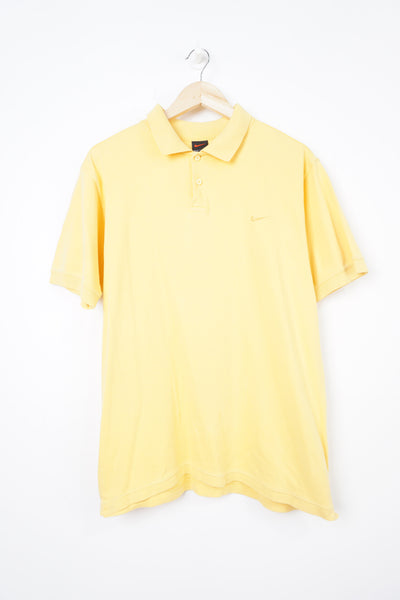 Late 90's Nike all yellow polo shirt with yellow embroidered swoosh logo on the chest 