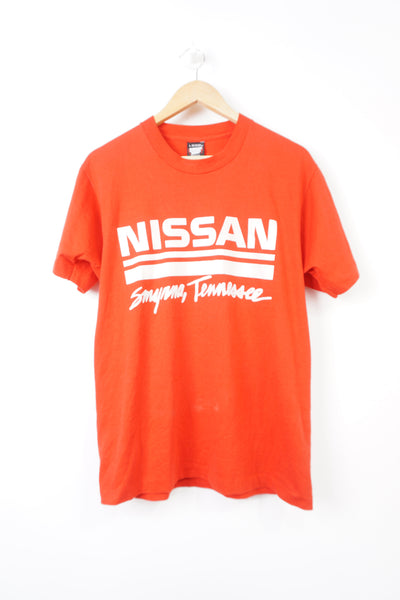 Vintage all red Nissan Smyrna single stitch, spell-out t-shirt with raised lettering