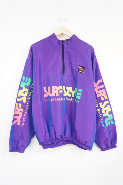 Vintage 90's Surf Style light weight metallic purple windbreaker style pullover with spell-out logo on the front