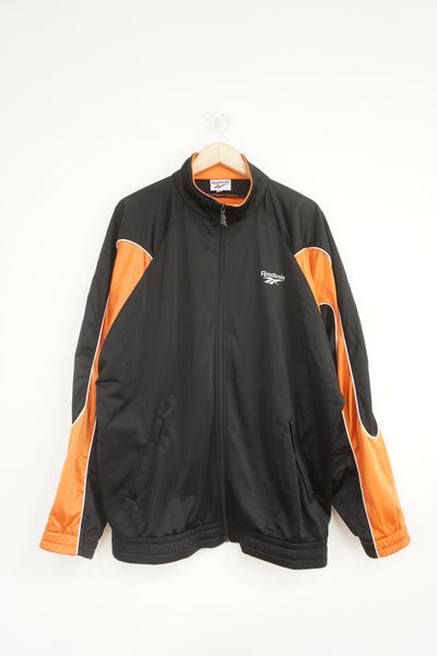 Vintage 90's Reebok zip through black and orange satin tracksuit top with embroidered logo on the chest and back