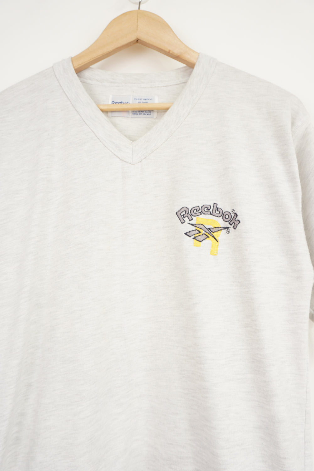 Vintage grey Reebok v-neck t-shirt with spell-out logo on the chest