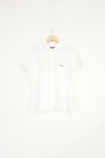 All white Reebok polo shirt with embroidered logo on the chest 