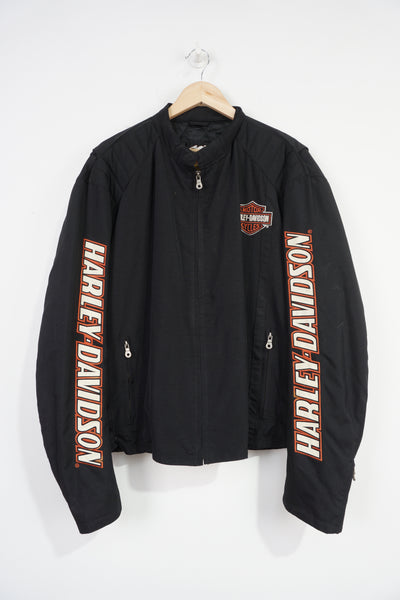 Harley Davidson all black nylon shell jacket with embroidered spell-out details down the sleeves and zip up pockets