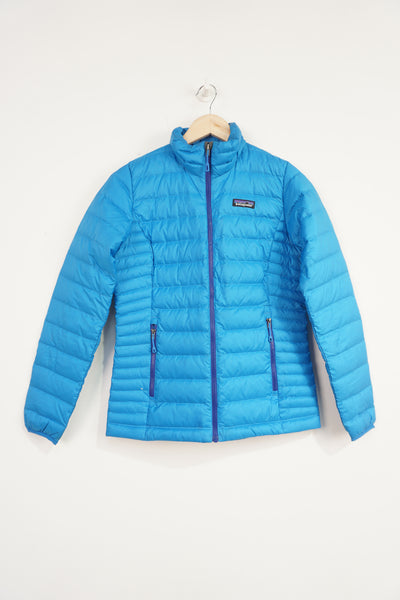All blue Patagonia lightly padded puffer jacket with zip up pockets and embroidered logo on the chest