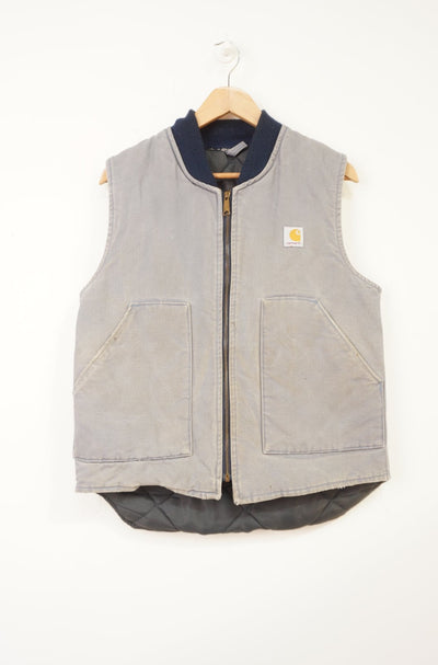 Vintage Carhartt faded blue heavy duty cotton workwear gilet with quilted lining and pockets