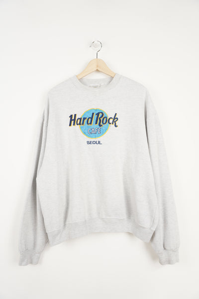 Vintage grey Hard Rock Cafe Seoul sweatshirt with embroidered spell-out logo on the front