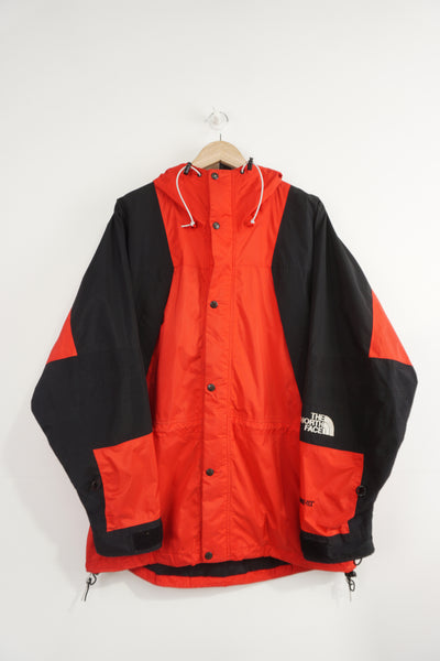 The North Face red and black Gor-tex zip through with embroidered logo and multiple pockets
