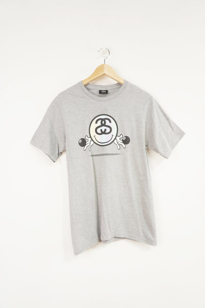 Stussy grey t-shirt with 8 ball graphic on the front