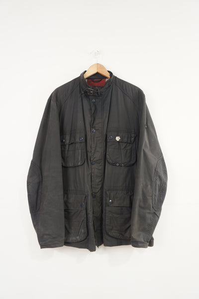 Barbour International wax jacket with multiple pockets and signature logo on the sleeve