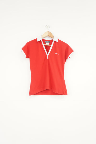 Red and white Reebok baby tee style v-neck t-shirt with embroidered logo on the chest