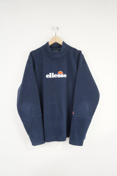Navy blue Ellesse fleece sweatshirt with embroidered spell-out logo across the chest