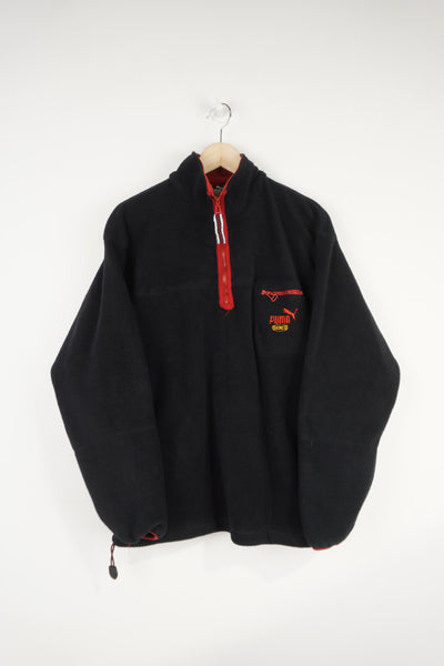 All black Puma King fleece with 1/4 zip fastening and embroidered logo on the chest