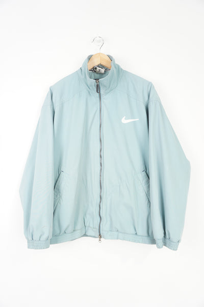 00's light blue Nike zip through bomber style jacket with embroidered logos on the chest and back of the collar 