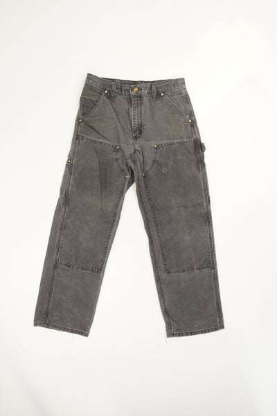 Stone grey Carhartt relaxed fit double knee carpenter jeans with multiple pockets and distressed details 