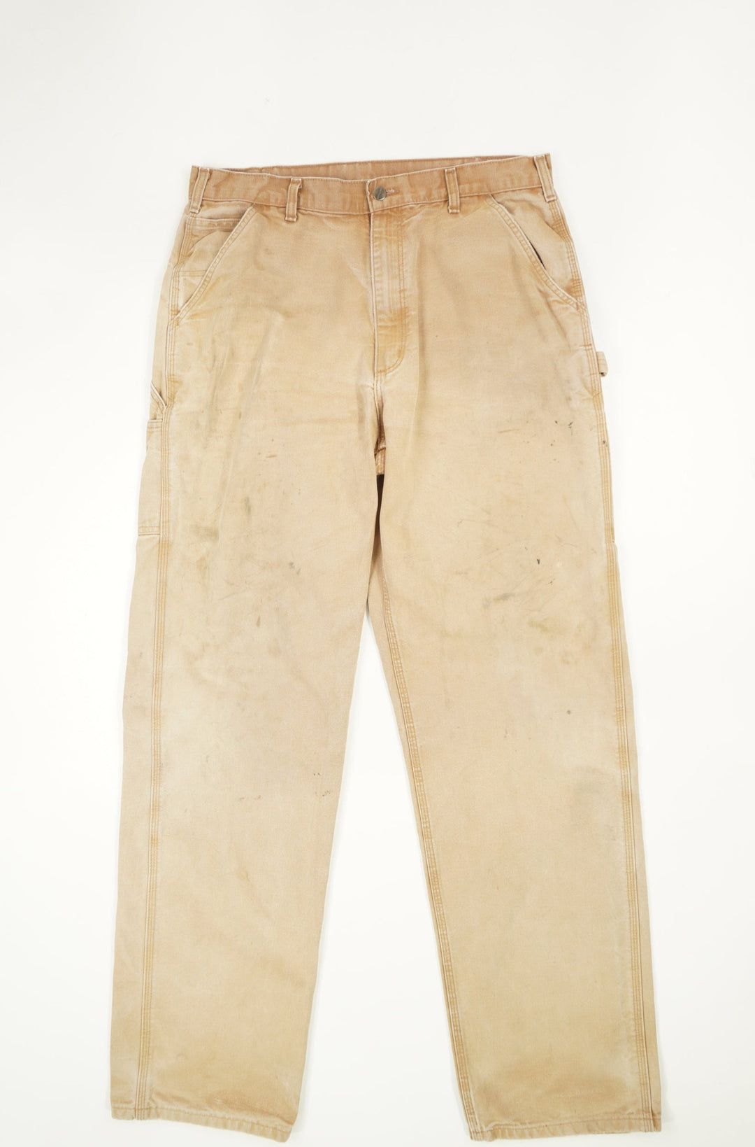 Tan Carhartt carpenter style jeans with multiple pockets