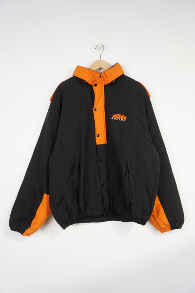 KTM Racing zip through padded coat features foldaway hood and embroidered logo on the chest