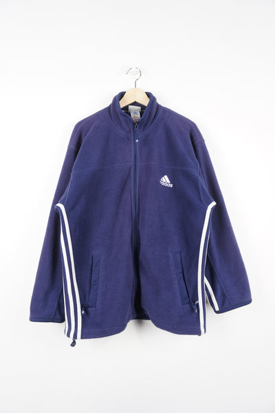 90s Adidas navy blue zip-through fleece features three stripe detail down the sides and embroidered logo on the chest