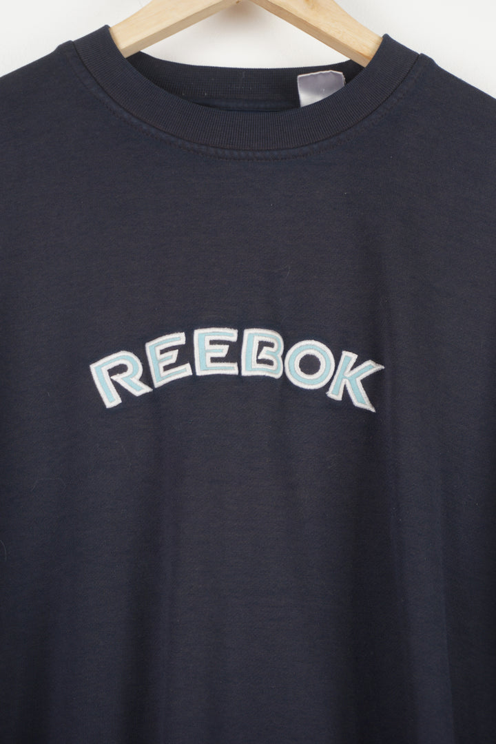 Navy blue Reebok sweatshirt features embroidered spell-out logo across the chest