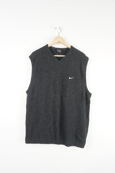Dark grey Nike wool vest, features signature embroidered swoosh logo on the chest