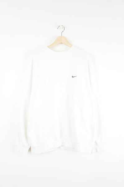 00s Nike white crewneck sweatshirt features embroidered swoosh logo on the chest