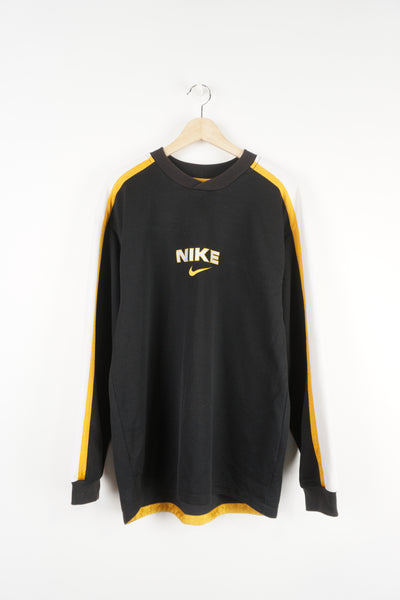 Vintage 90's Nike black and yellow spell out sweatshirt features embroidered swoosh logo on the front and back