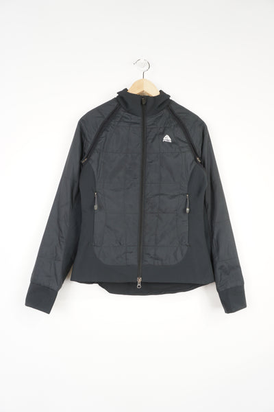 Women's Nike ACG zip through black lightly padded convertible jacket, features zip off sleeves so it can be worn as a gilet