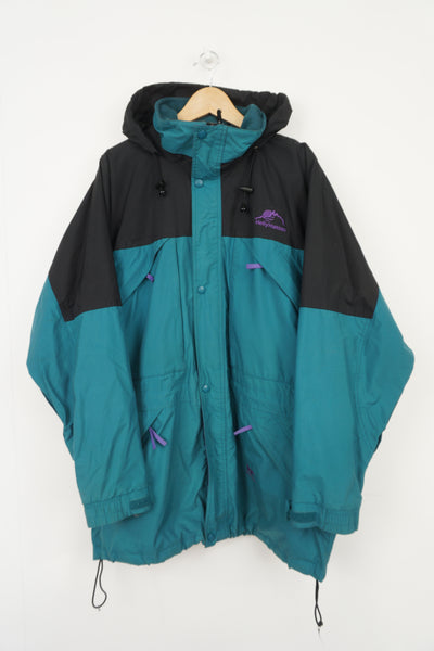 Vintage 90's green and black Helly Hansen waterproof jacket with embroidered badge on the chest
