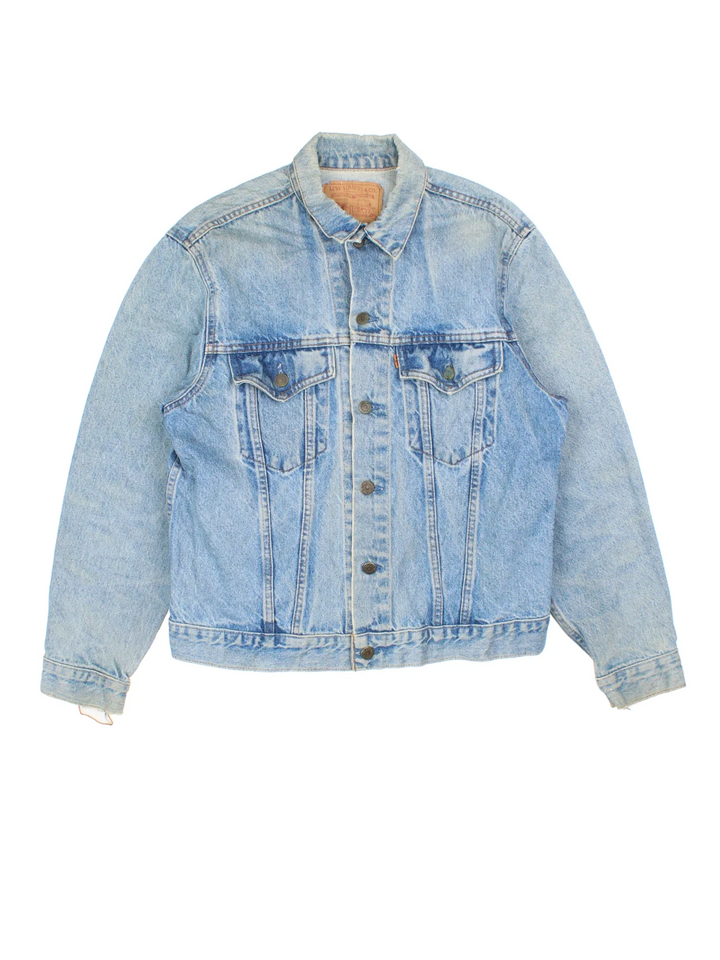Vintage Levi Strauss Orange Tab Denim Jacket in a blue colourway. Buttons up and has double chest pockets, and the logo tab embroidered on the front.