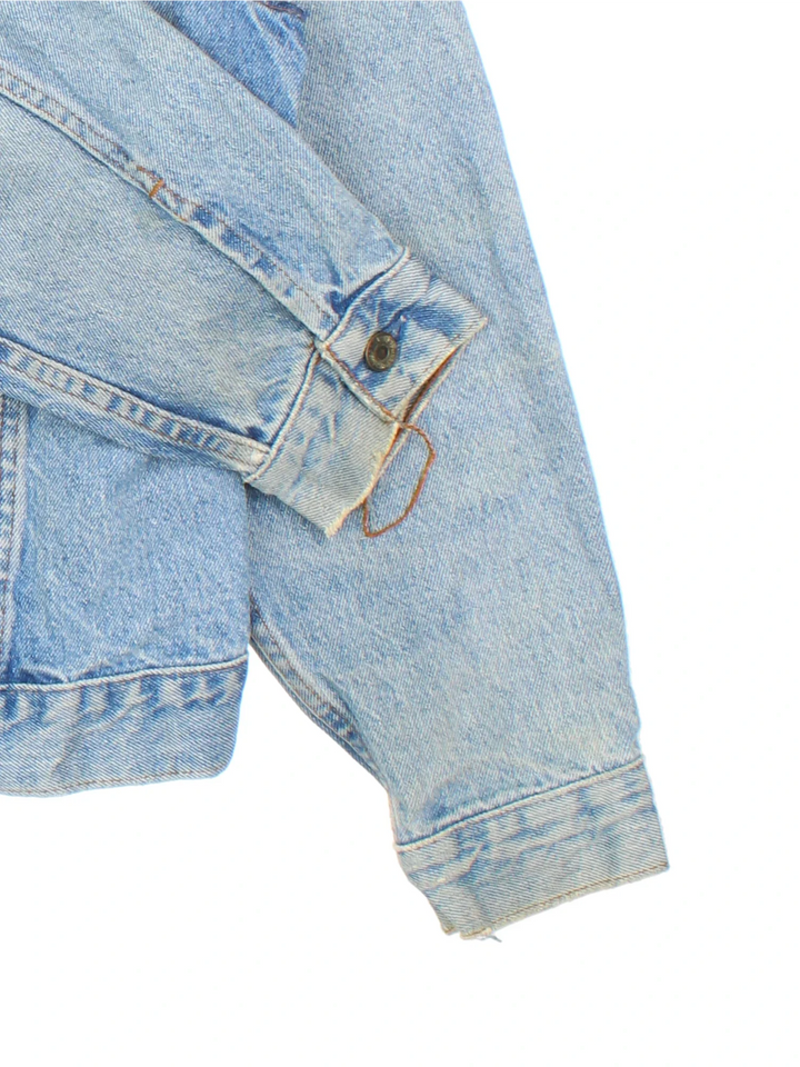 Vintage Levi Strauss Orange Tab Denim Jacket in a blue colourway. Buttons up and has double chest pockets, and the logo tab embroidered on the front.