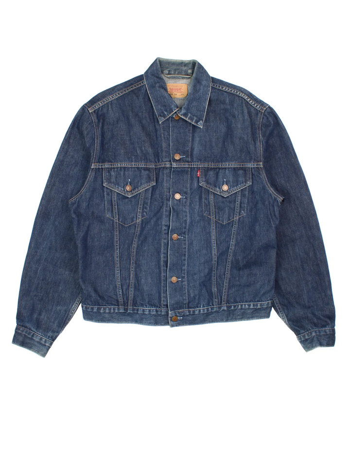 Vintage Levi Strauss Denim Jacket in a blue colourway. Buttons up and has double chest pockets, and the logo tab embroidered on the front.