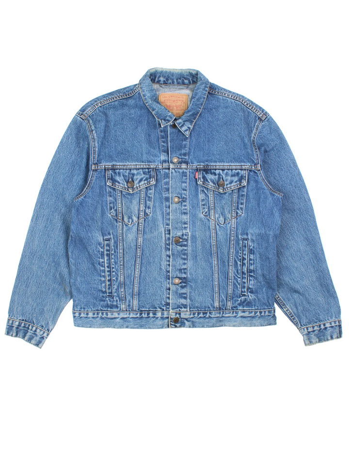 Vintage Levi Strauss Denim Jacket in a blue colourway. Buttons up and has multiple pockets, and the logo tab embroidered on the front.