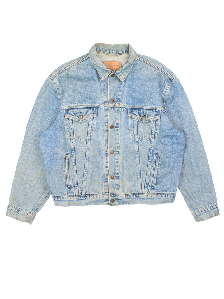 Vintage Levi Strauss Denim Jacket in a blue colourway. Buttons up and has multiple pockets, and the logo tab embroidered on the front.