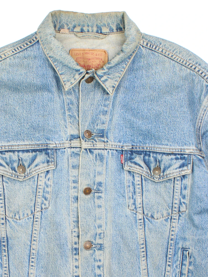 Vintage Levi Strauss Denim Jacket in a blue colourway. Buttons up and has multiple pockets, and the logo tab embroidered on the front.