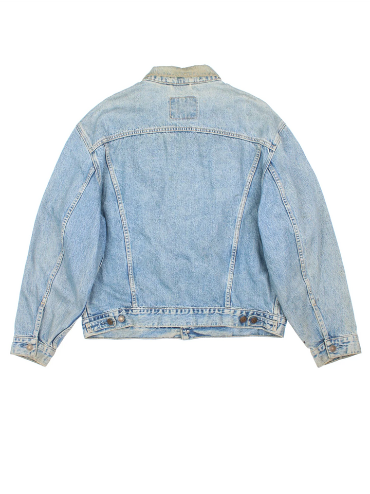 Vintage Levi Strauss Denim Jacket in a blue colourway. Buttons up and has multiple pockets, and the logo tab embroidered on the front.