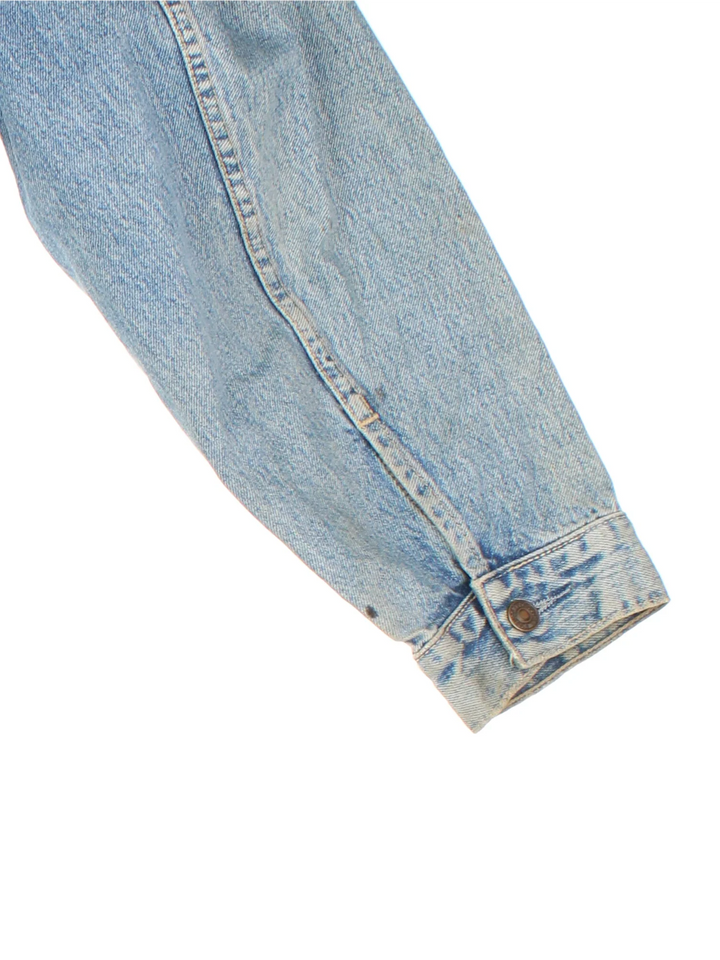 Vintage Levi Strauss Denim Jacket in a blue colourway. Buttons up and has multiple pockets, and the logo tab embroidered on the front.