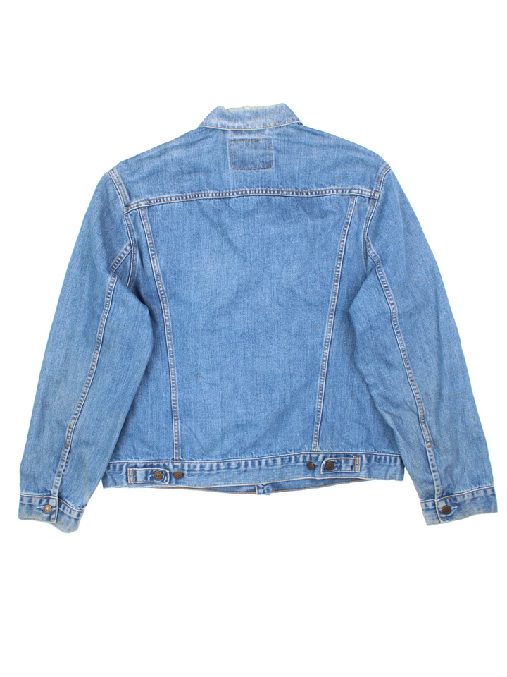 Vintage Levi Strauss Denim Jacket in a blue colourway. Buttons up and has multiple pockets, and the logo tab embroidered on the front.