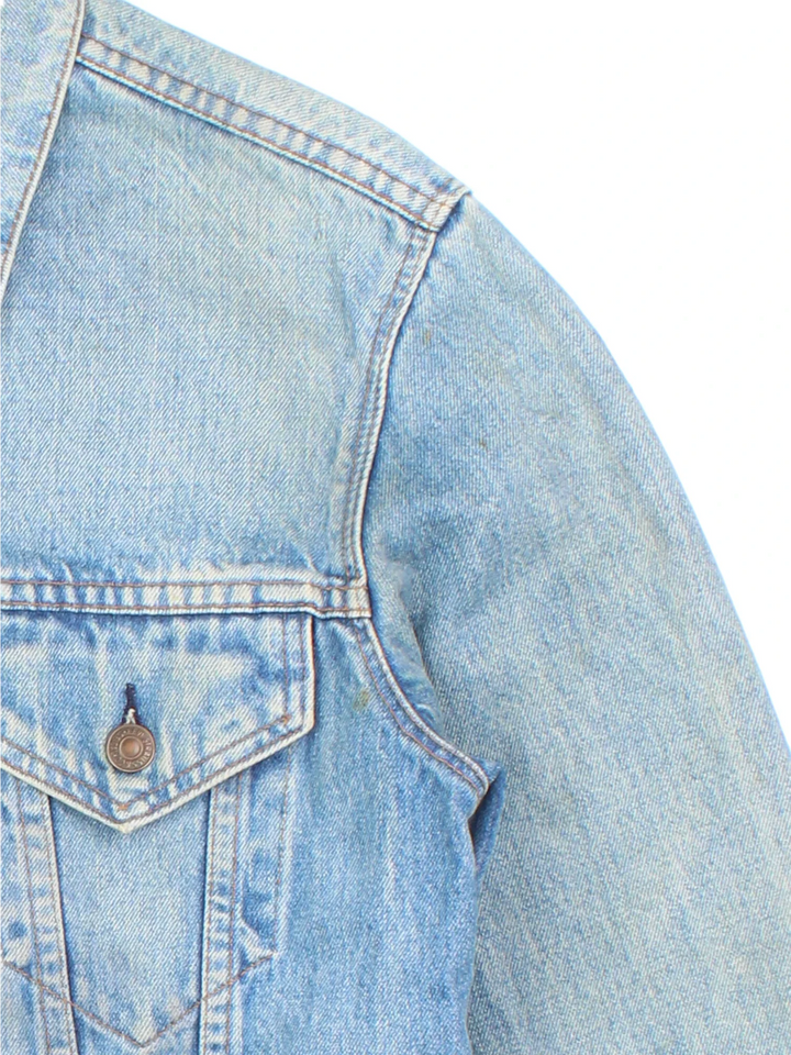 Vintage Levi Strauss Denim Jacket in a blue colourway. Buttons up and has double chest pockets, and the logo tab embroidered on the front.