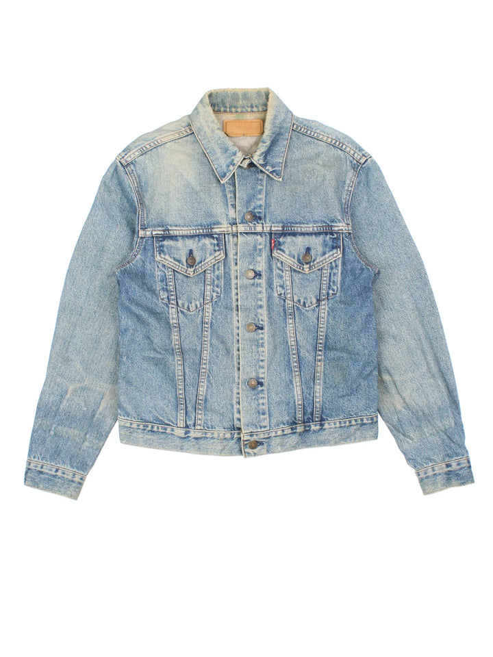 Vintage Levi Strauss Denim Jacket in a blue colourway. Buttons up and has double chest pockets, and the logo tab embroidered on the front.