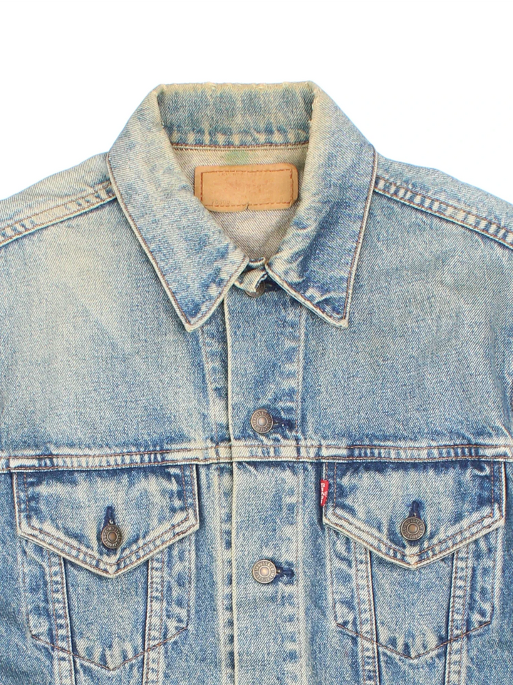 Vintage Levi Strauss Denim Jacket in a blue colourway. Buttons up and has double chest pockets, and the logo tab embroidered on the front.