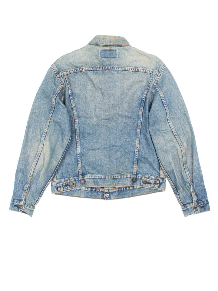Vintage Levi Strauss Denim Jacket in a blue colourway. Buttons up and has double chest pockets, and the logo tab embroidered on the front.