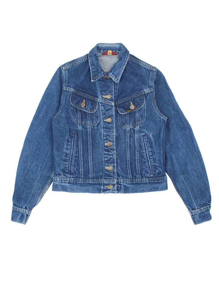 Vintage Ms Lee Denim Jacket in a blue colourway. Buttons up and has multiple pockets, and the logo tab embroidered on the front.