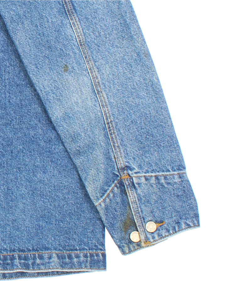 Vintage Lauren By Ralph Lauren Denim Chore Jacket in a blue colourway. Buttons up and has multiple pockets, and the logo embroidered on the front.