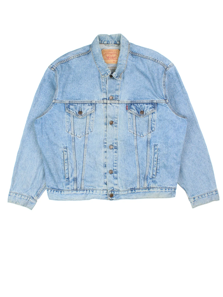Vintage Levi Strauss Denim Jacket in a blue colourway. Buttons up and has multiple pockets, and the logo embroidered on the front.