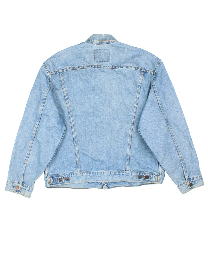 Vintage Levi Strauss Denim Jacket in a blue colourway. Buttons up and has multiple pockets, and the logo embroidered on the front.