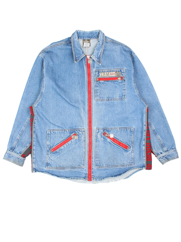 Vintage Sir Benni Miles Denim Jacket in a blue colourway with red detailing. Buttons up and has multiple pockets, and the logo embroidered on the front and back.