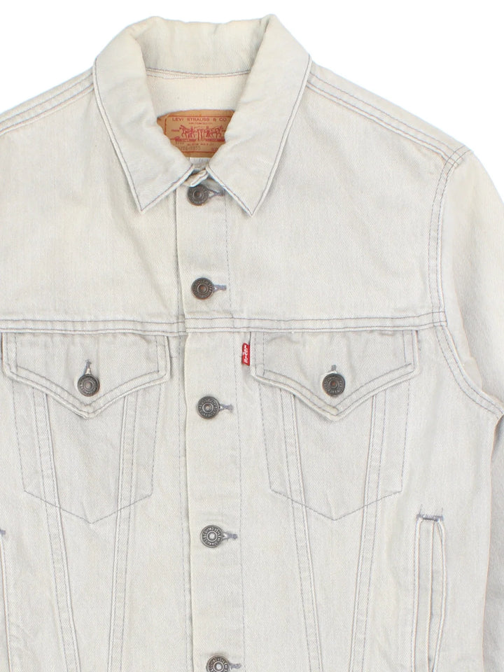 Vintage Levi Strauss Denim Jacket in a grey colourway. Buttons up and has multiple pockets, and the logo embroidered on the front.
