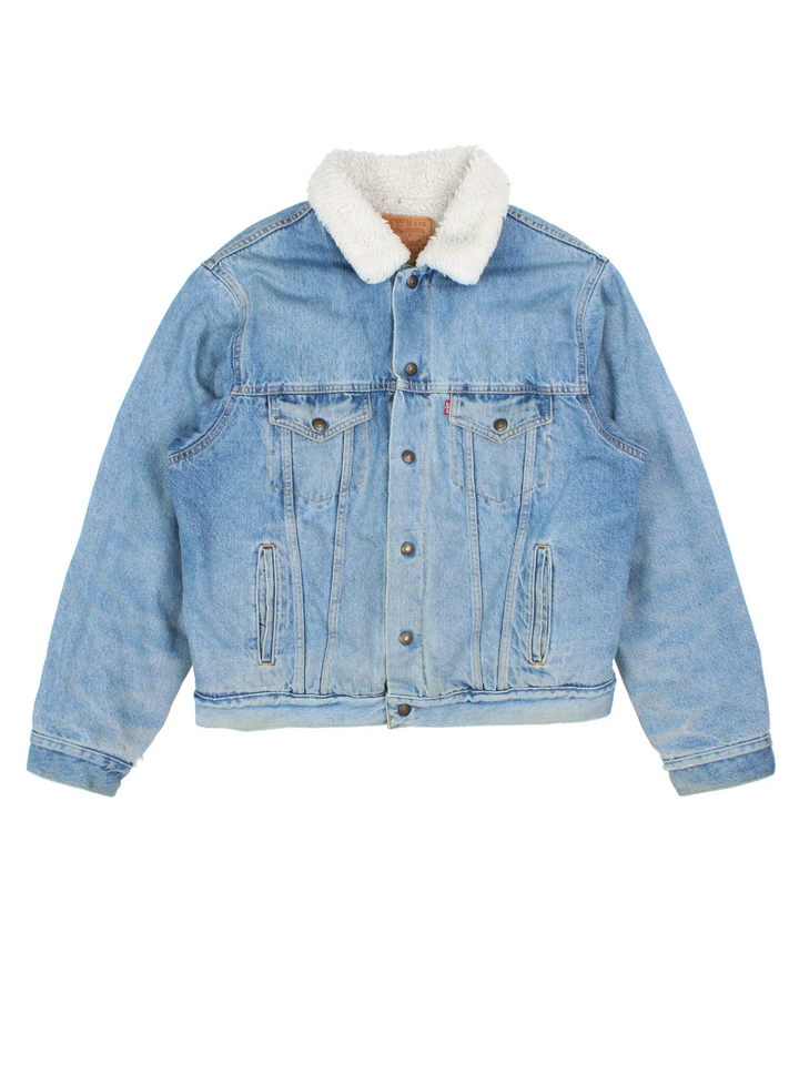 Vintage Levi Strauss Denim Sherpa Jacket in a blue colourway. Buttons up and has multiple pockets, insulated with a sherpa lining, and the logo embroidered on the front.