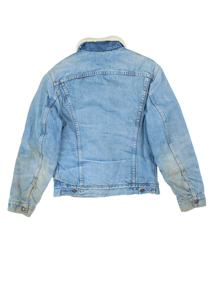 Vintage Levi Strauss Denim Sherpa Jacket in a blue colourway. Buttons up and has multiple pockets, insulated with a sherpa lining, and the logo embroidered on the front.