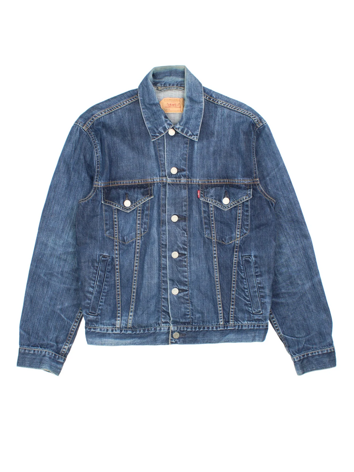 Vintage Levi Strauss Trucker Denim Jacket in a blue colourway. Buttons up and has multiple pockets, and the logo tab embroidered on the chest.