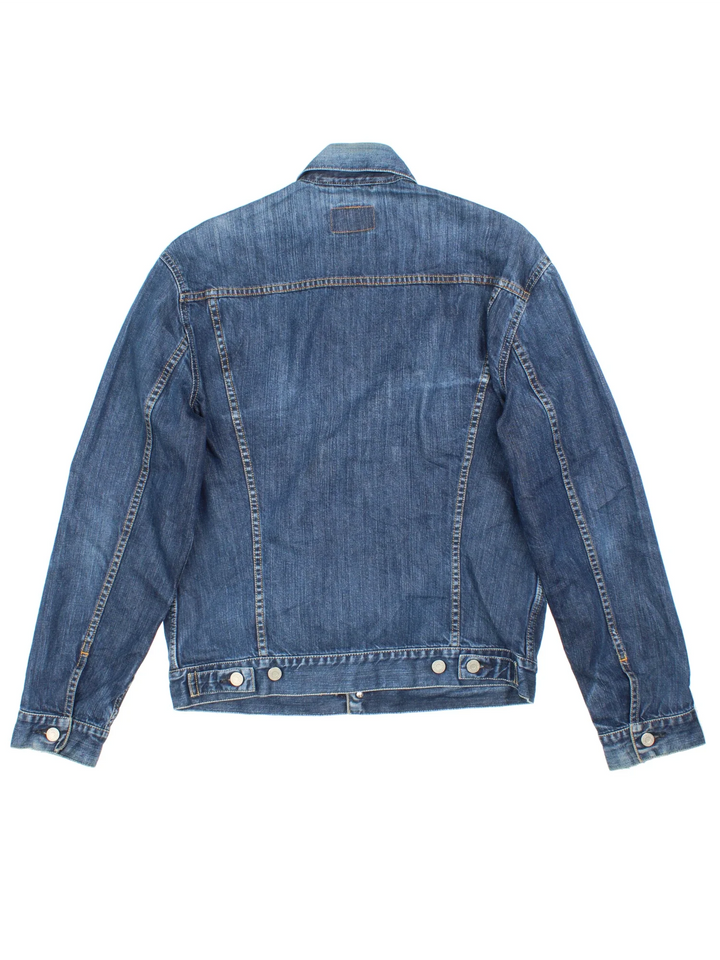 Vintage Levi Strauss Trucker Denim Jacket in a blue colourway. Buttons up and has multiple pockets, and the logo tab embroidered on the chest.